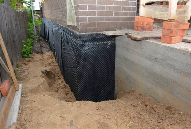 Happy homeowners after waterproofing job in Breedsville